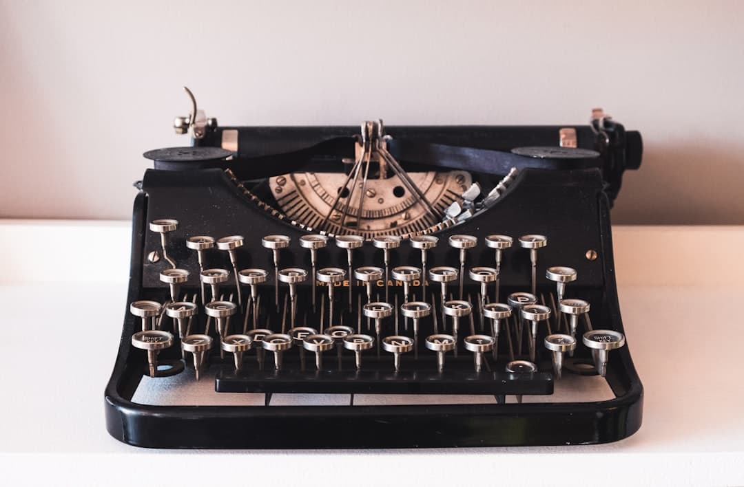 How the Printing Press Changed the World Forever — A vintage black typewriter on a white surface.